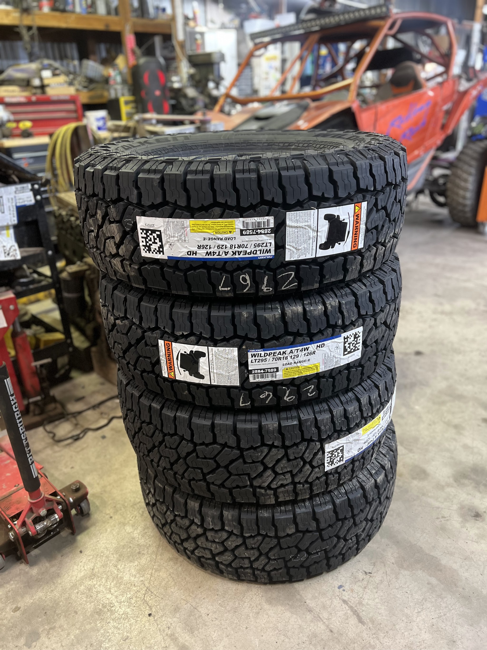 A fresh stack of Falken Wildpeak all terrain tires ready to go on